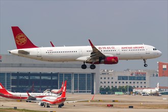 A Juneyao Airlines Airbus A321 with registration number B-8957 at Shanghai Hongqiao Airport