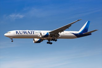 A Kuwait Airways Boeing 777-300ER aircraft with registration number 9K-AOC lands at London Heathrow Airport