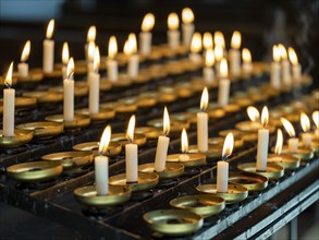 Burning sacrificial candles