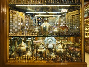 Copper vessels and chess pieces in the bazaar