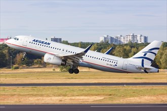 An Airbus A320 of Aegean Airlines with the registration SX-DNC takes off from Berlin-Tegel Airport