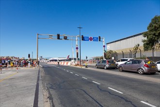 Road with traffic lights in front of the runway of Gibraltar Airport