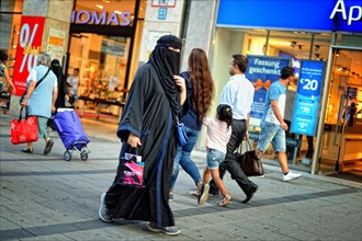 Young woman with burka shopping in Munich