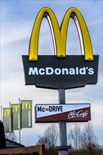 Logo of the fast food chain McDonald's at a restaurant
