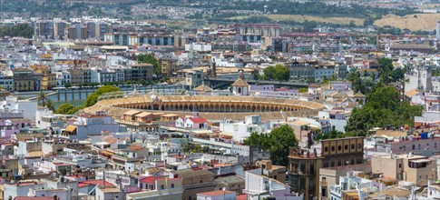 View from above over Seville with bullring Plaza de toros de la Real Maestranza de Caballeria de Sevilla