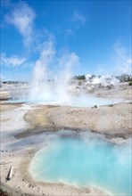Steaming hot springs with turquoise water