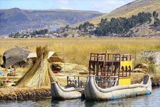 Typical reed boats at a floating island of the Uro
