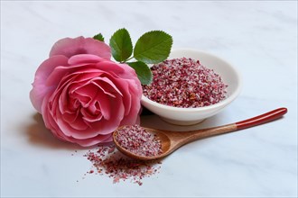 Rose salt in bowl and spoon