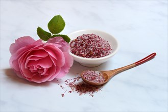 Rose salt in bowl and spoon