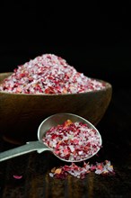 Rose salt in bowl and spoon