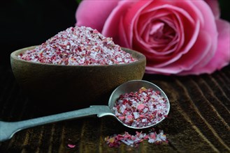Rose salt in bowl and spoon