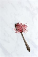 Rose salt in spoon