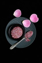 Rose salt in bowl and spoon