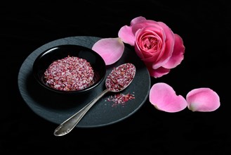 Rose salt in bowl and spoon