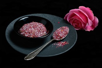 Rose salt in bowl and spoon