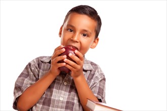 Adorable hispanic boy eating a large red apple isolated on a white background