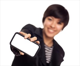 Smiling young mixed-race woman holding blank smart phone out