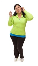 Attractive middle aged hispanic woman in workout clothes with music player and headphones against a white background