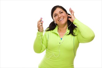 Attractive middle aged hispanic woman in workout clothes with music player and headphones against a white background