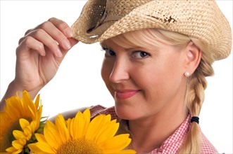Attractive blond with cowboy hat and sunflower isolated on a white background