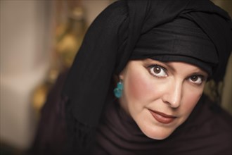Beautiful smiling islamic woman wearing traditional burqa or niqab