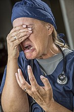 Hysterical agonizing crying female doctor or nurse