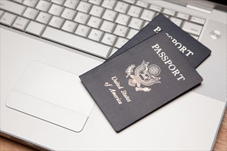 Abstract of two passports on a laptop computer keyboard