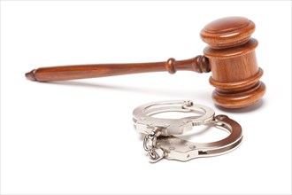 Gavel and handcuffs isolated on a white background