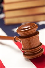 Gavel and books on the american flag with selective focus