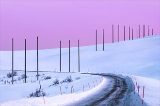 Electricity pylons in winter landscape