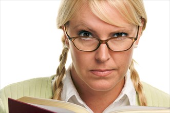 Serious female with ponytails and book isolated on a white background