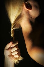 Abstract dramatically lit image of woman's shoulder