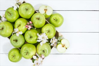 Apples fruits green apple fruit box on wooden board text free space copyspace with flowers and leaves