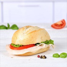 Roll sandwich baguette topped with ham square text free space copyspace on wooden board in germany