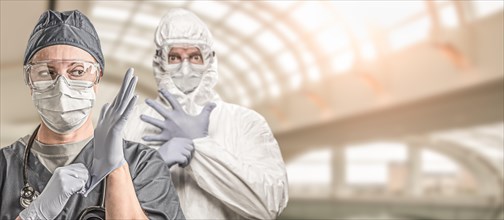 Female and male doctors or nurses wearing scrubs and protective mask and goggles banner