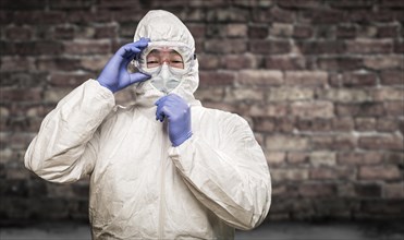 Chinese man wearing hazmat suit