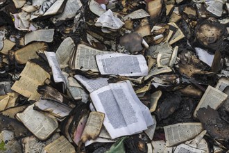 Charred remains of books after arson