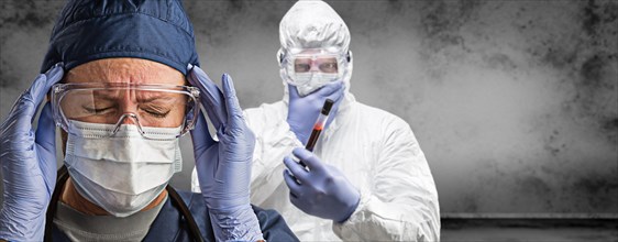 Female and male doctors or nurses wearing scrubs and protective mask and goggles banner