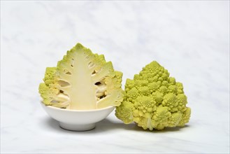 Halved cauliflower Romanesco on a decorative plate