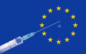 Symbol photo syringe with vaccine and EU stars