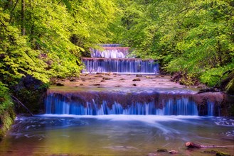 Village stream with waterfalls