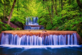 Village stream with waterfalls