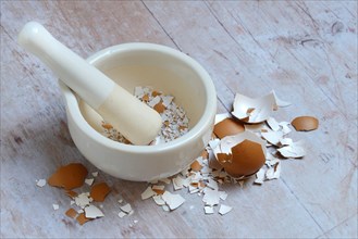 Broken eggshells crushed with mortar