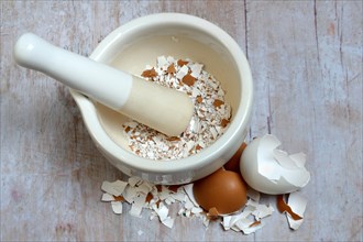 Broken eggshells crushed with mortar