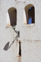 Lamp with shadow at the bell tower
