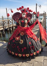 Woman in carnival constume and mask on carnival in Venice