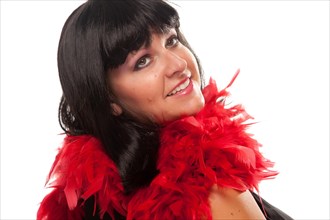 Pretty girl smiling with red feather boa isolated on a white background