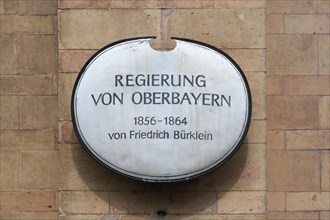 Info sign on the building of the government of Upper Bavaria