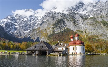 Pilgrimage church in front of mountains with snow