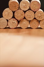 Stack of wine corks on a wood surface